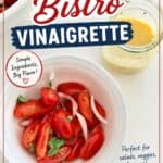 Fresh cherry tomatoes, herbs, and vinaigrette dressing in a bowl, ideal for salads and vegetables.