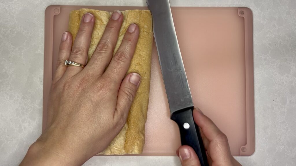 knife slicing bread open