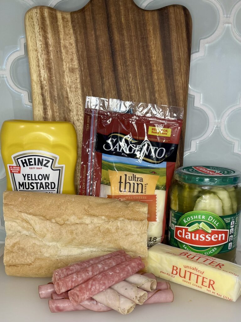 Cuban bread, meat, cheese, and condiments