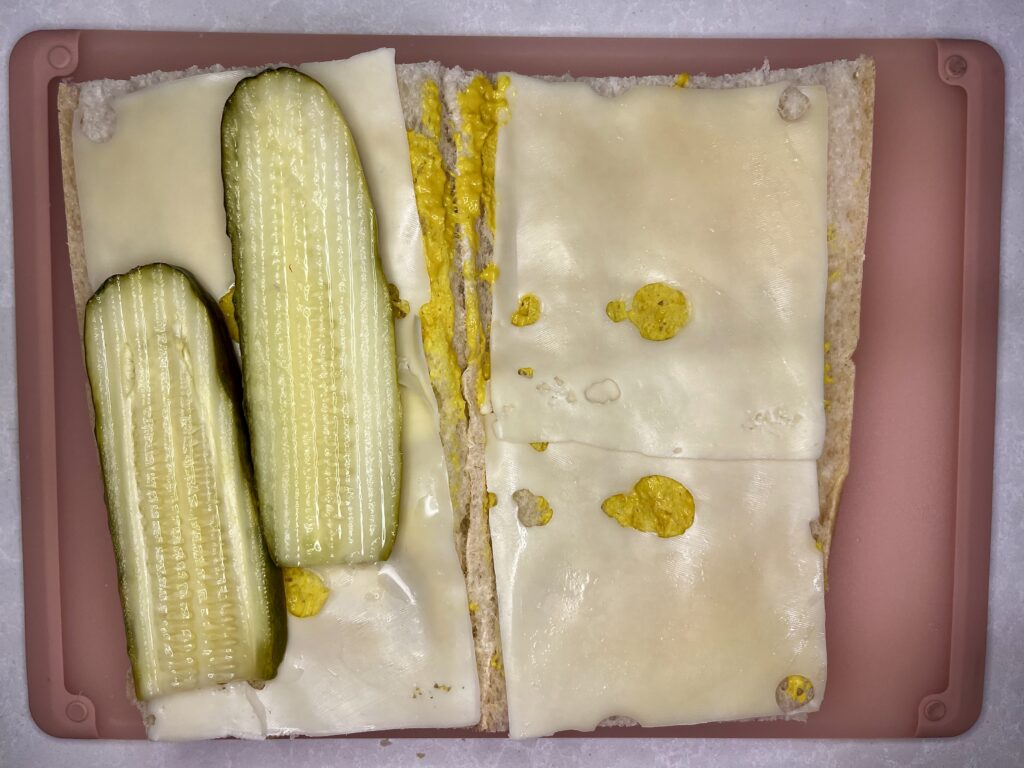 cheese, pickles, and mustard on bread