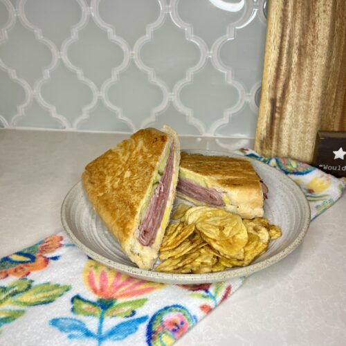 pressed Cuban sandwich on a plate