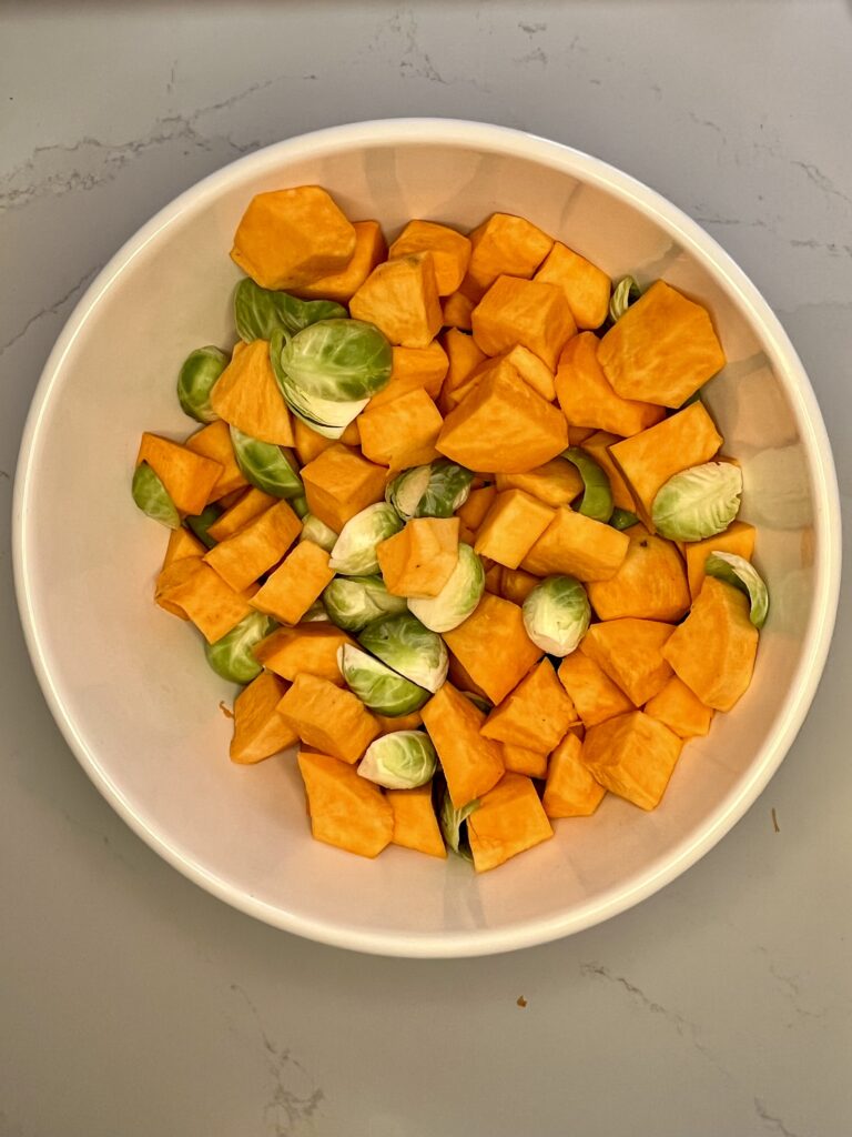 Brussel sprouts and sweet potatoes in a bowl