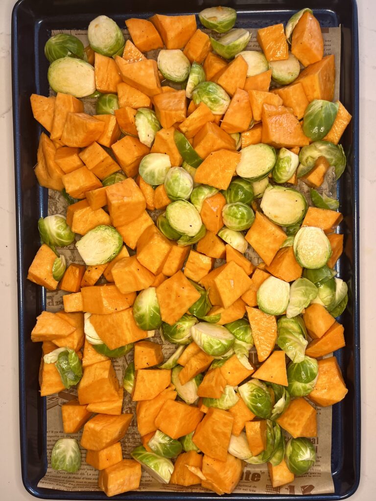 Brussel sprouts and sweet potatoes on a sheet pan