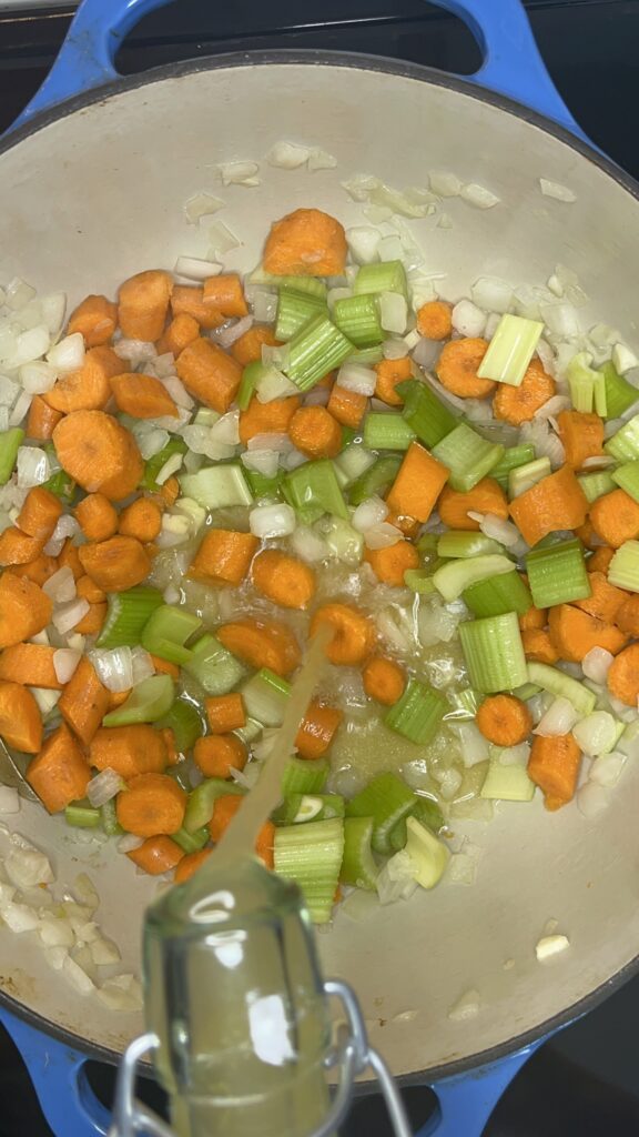 carrots, celery, onions, garlic and chicken broth in stockpot.
