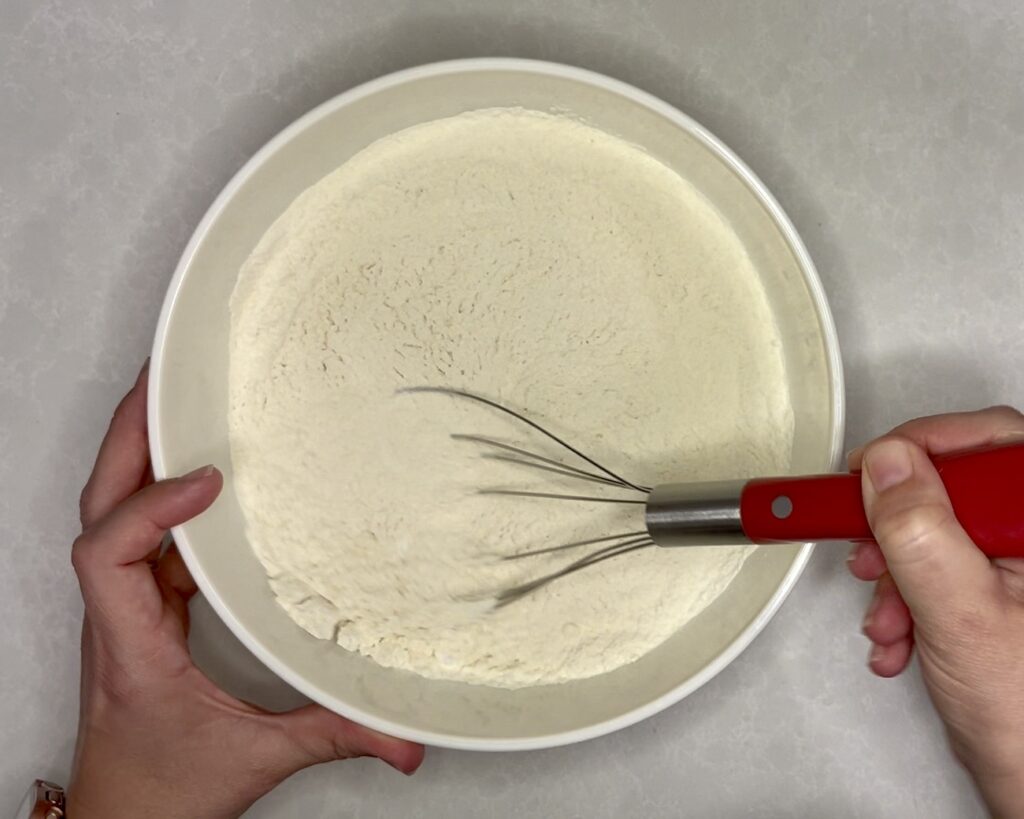 flour, salt, and baking soda whisked in a bowl