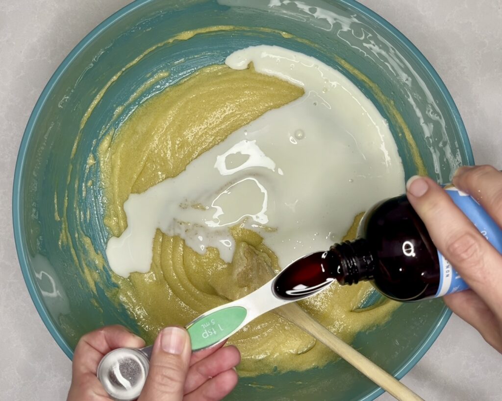 vanilla and buttermilk being added to bowl