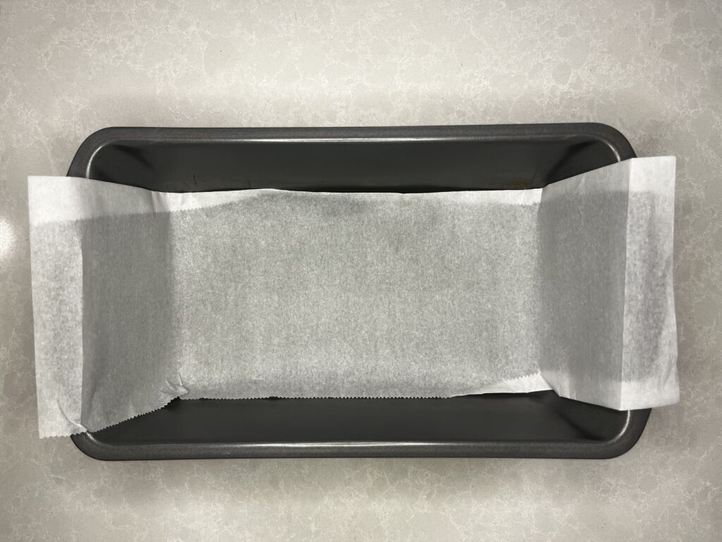 a loaf pan lined with parchment paper