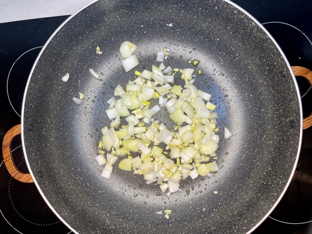 onion and garlic sautéing in a large pan