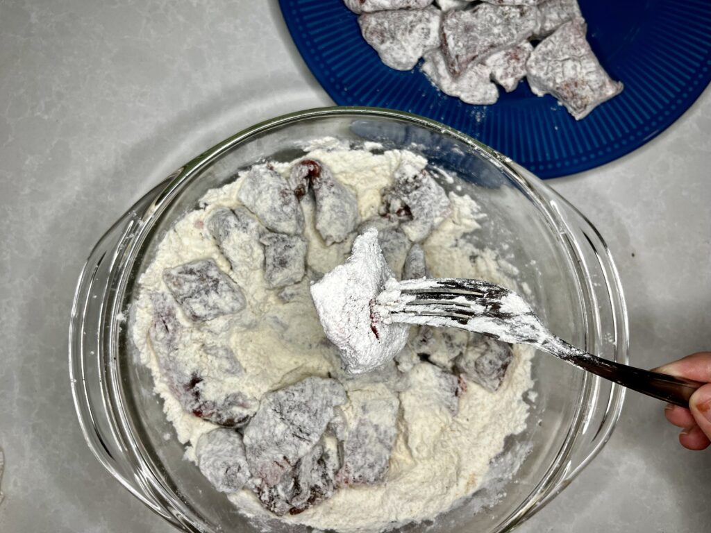 beef in a bowl of flour