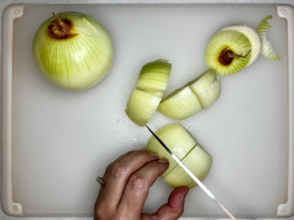 onions being cut into eighths 