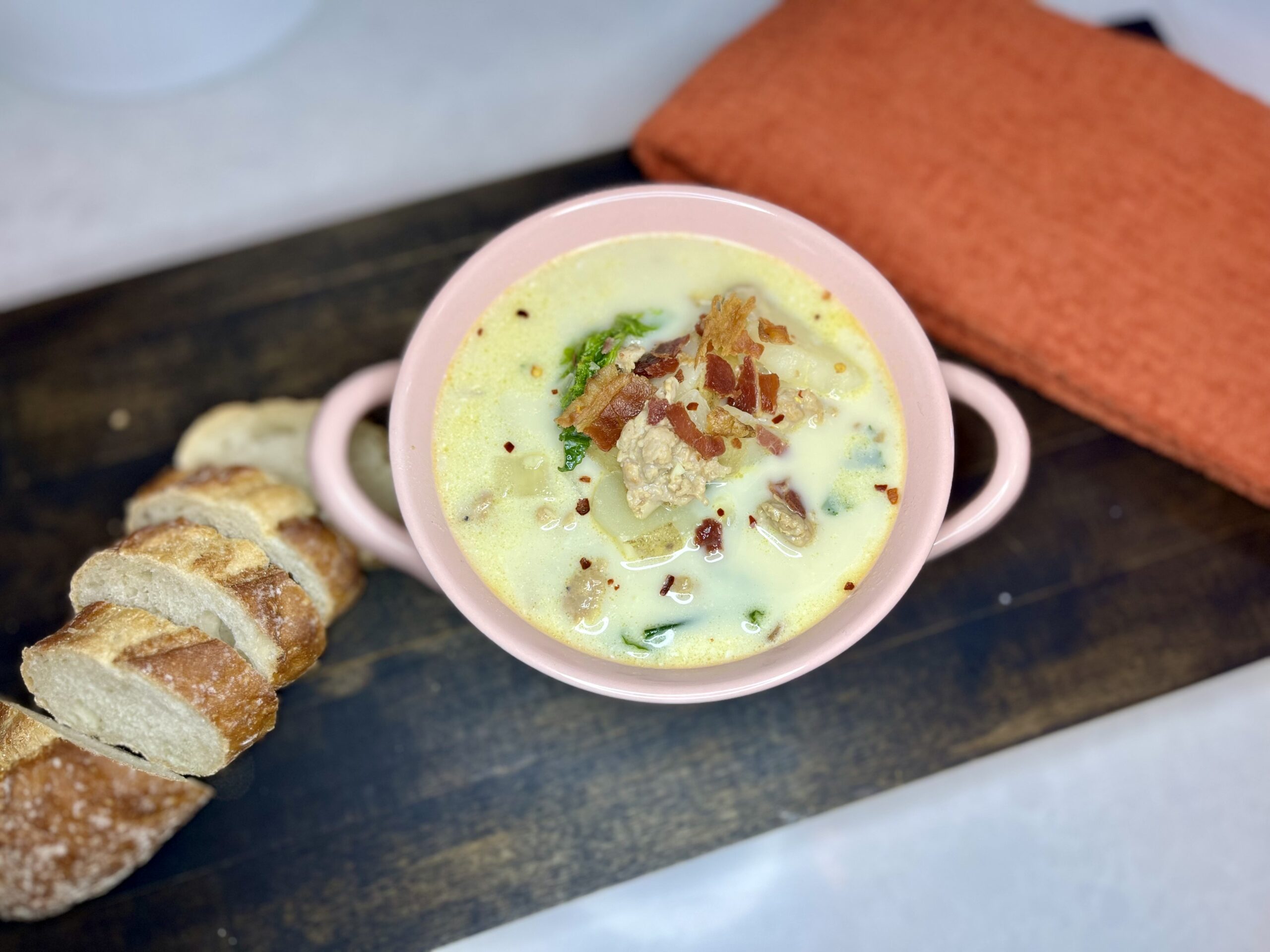 zesty Italian soup in a bowl with sliced bread