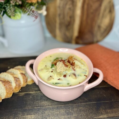 zesty Italian soup in a bowl with sliced bread