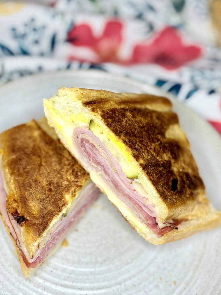 a pressed cuban sandwich on a plate