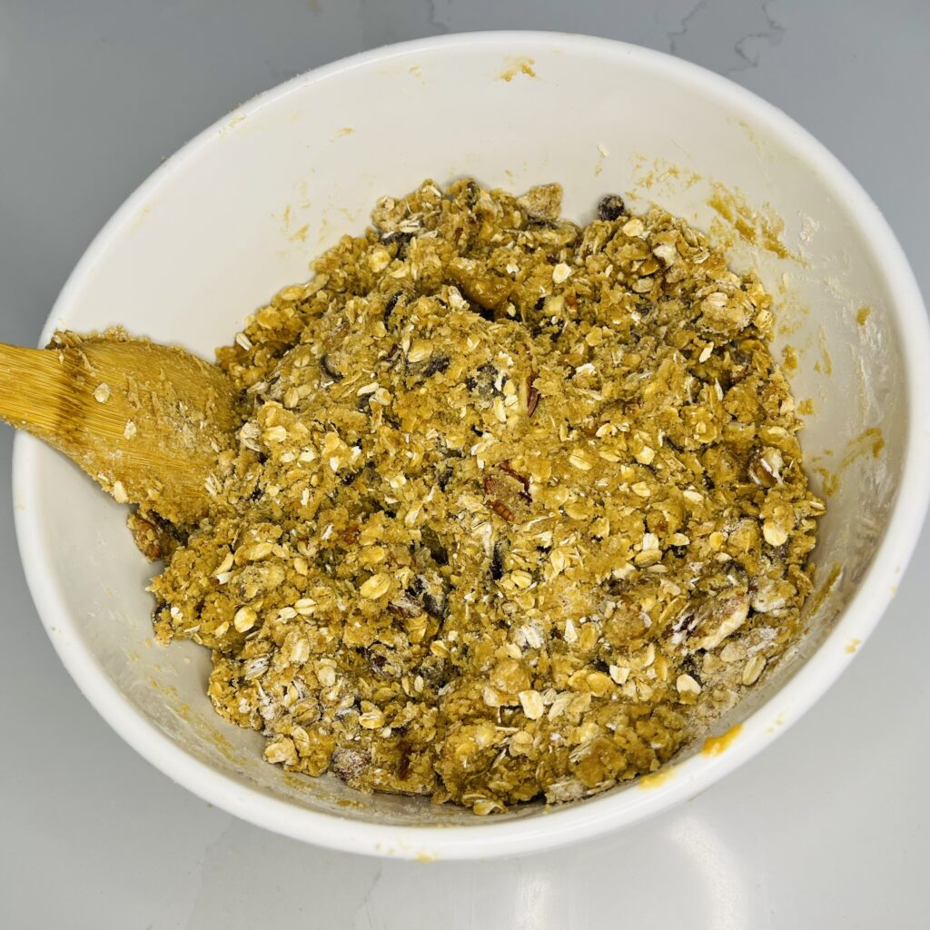 mixed cookie dough in a large mixing bowl
