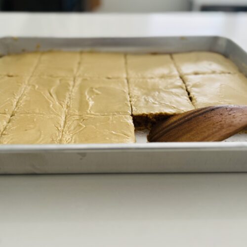 sheet cake of pumpkin cake with brown sugar icing.