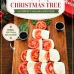 Caprese salad arranged in the shape of a Christmas tree with fresh tomatoes, mozzarella, basil, and balsamic vinegar on a wooden board.