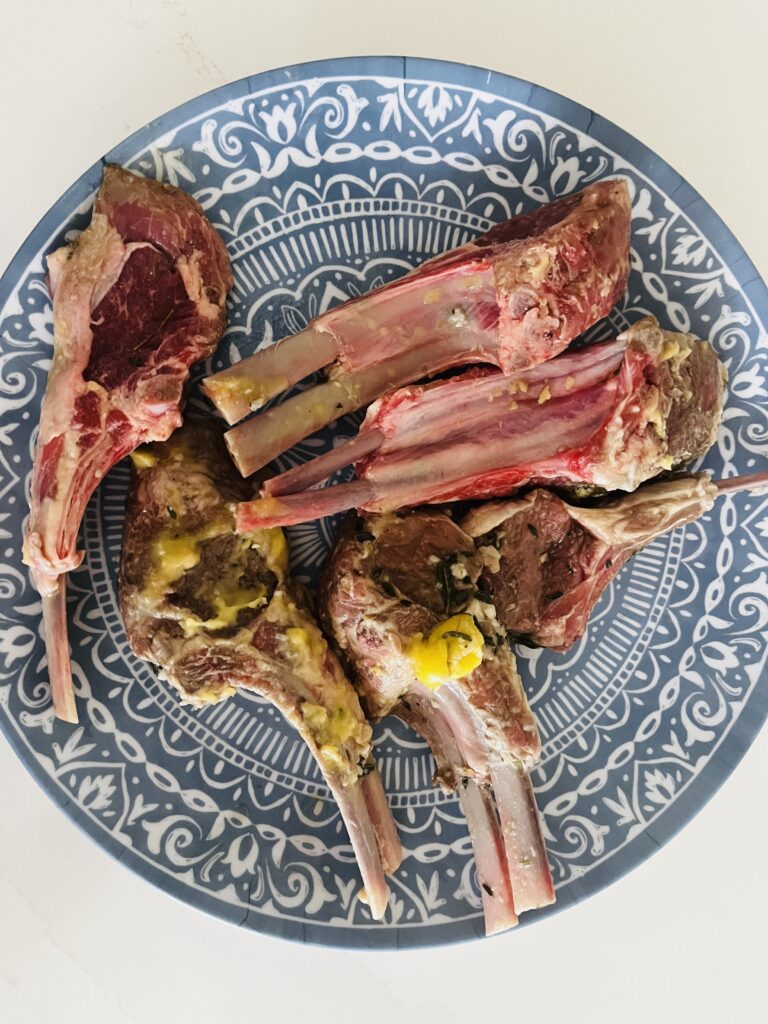 Marinated double lamb chops, on a blue plate