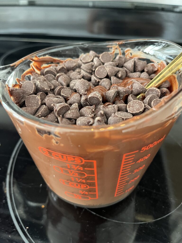 semi-melted chocolate in a microwave safe dish.