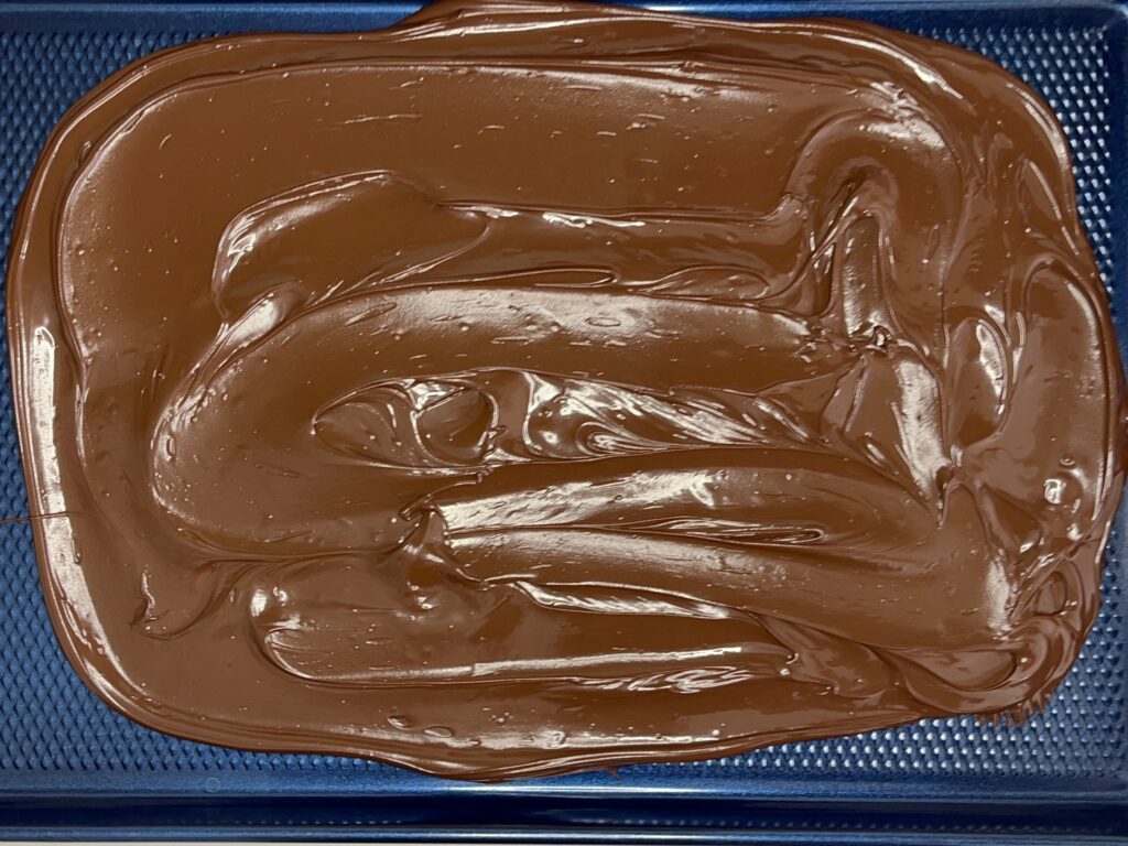 Melted chocolate and spread out onto a baking sheet.