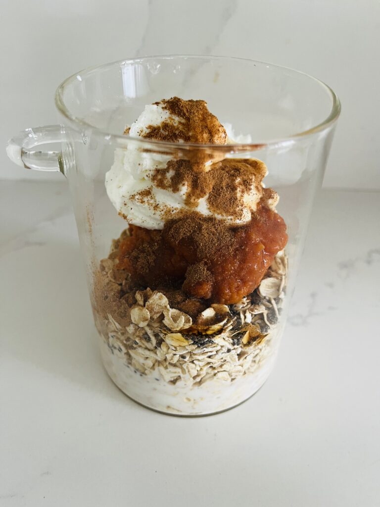 Layered ingredients in a glass jjar on the counter 