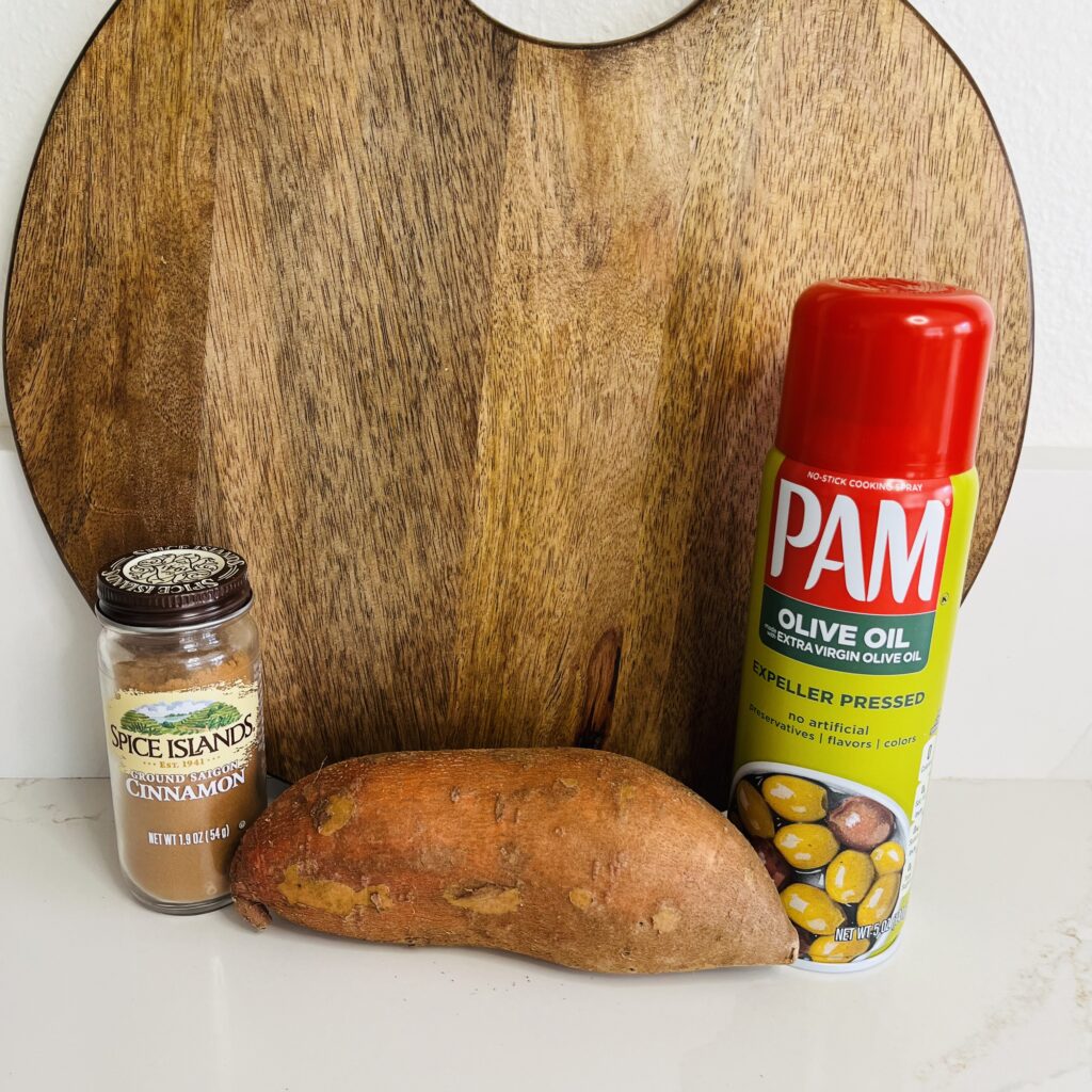 cinnamon, sweet potato and non-stick spray on the counter