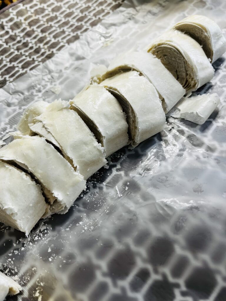 1/2 inch thick cut phyllo rolls on wax paper on the counter