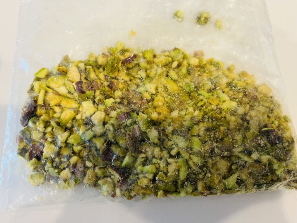 crushed pistachios in ziploc bag on thecounter