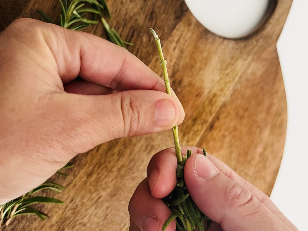 If mincing herbs such as rosemary, hold your thumb and finger at the thickest part of the stem and using your other hand, run it down the stem quickly separating the rosemary from the stem.