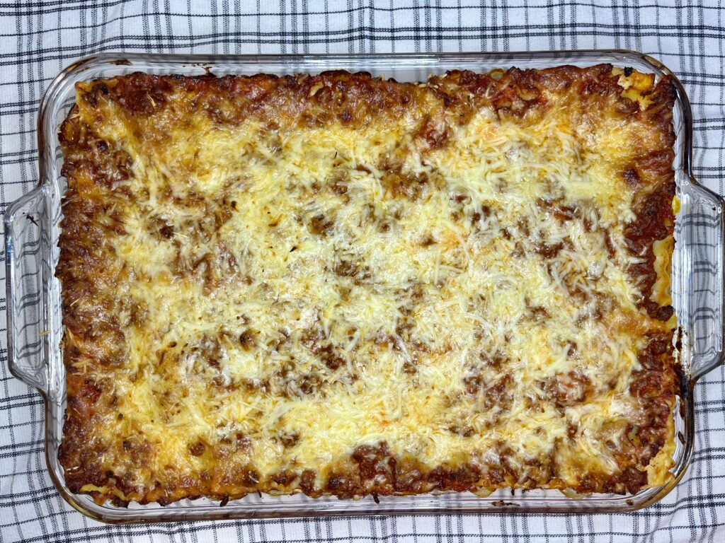 cooked lasagna in a baking dish