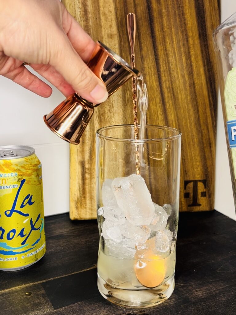 gin being poured into a glass
