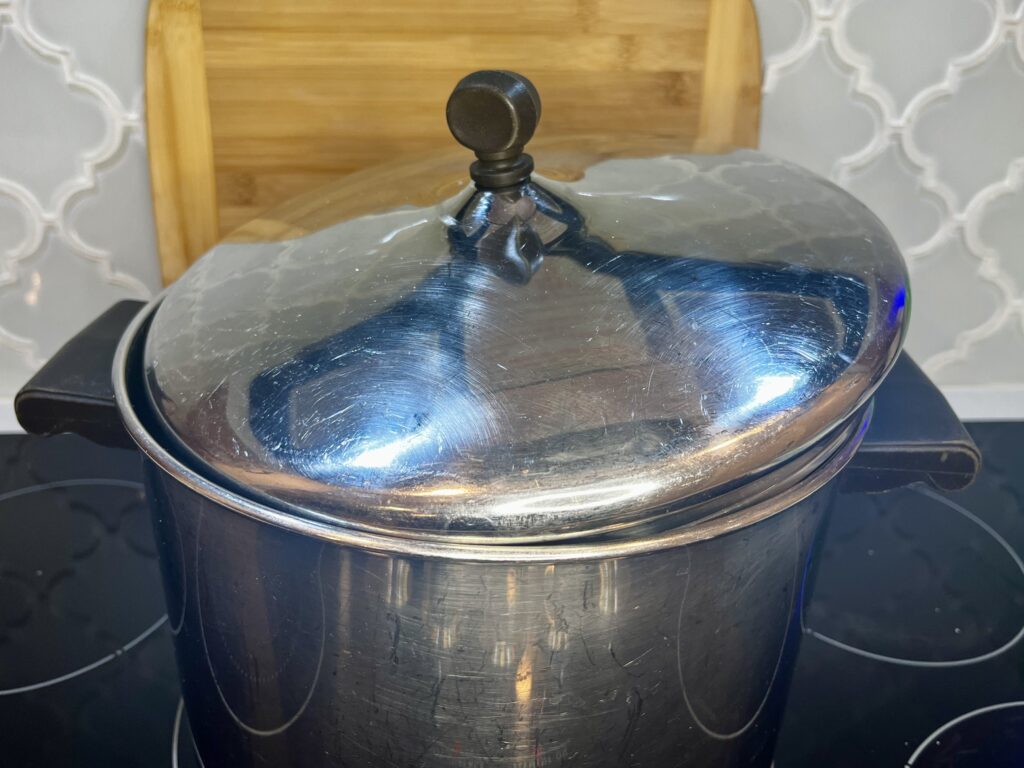 a pot partially covered with a lid