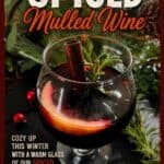Spiced mulled wine in a glass garnished with cinnamon and rosemary, perfect for winter cozying up.