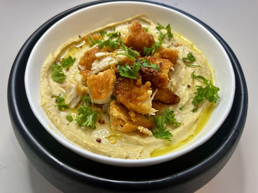 Crisp chicken hummus in a bowl.