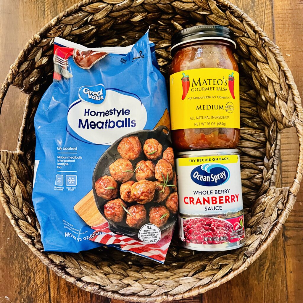 Package of frozen meatballs, salsa and cranberry sauce in a basket