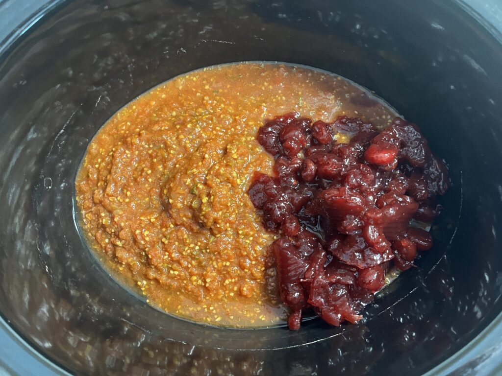 salsa and cranberry sauce in a slow cooker