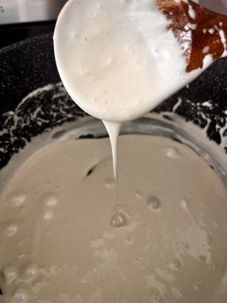 melted butter and marshmallows in a pot on the stove.