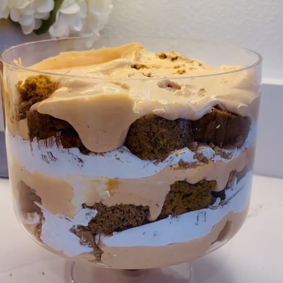 Layer trifle in glass container on counter