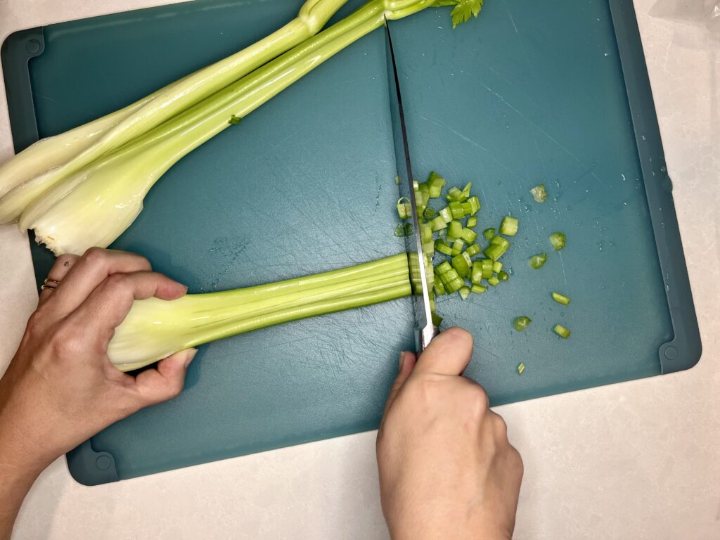 celery being chopped into small pieces