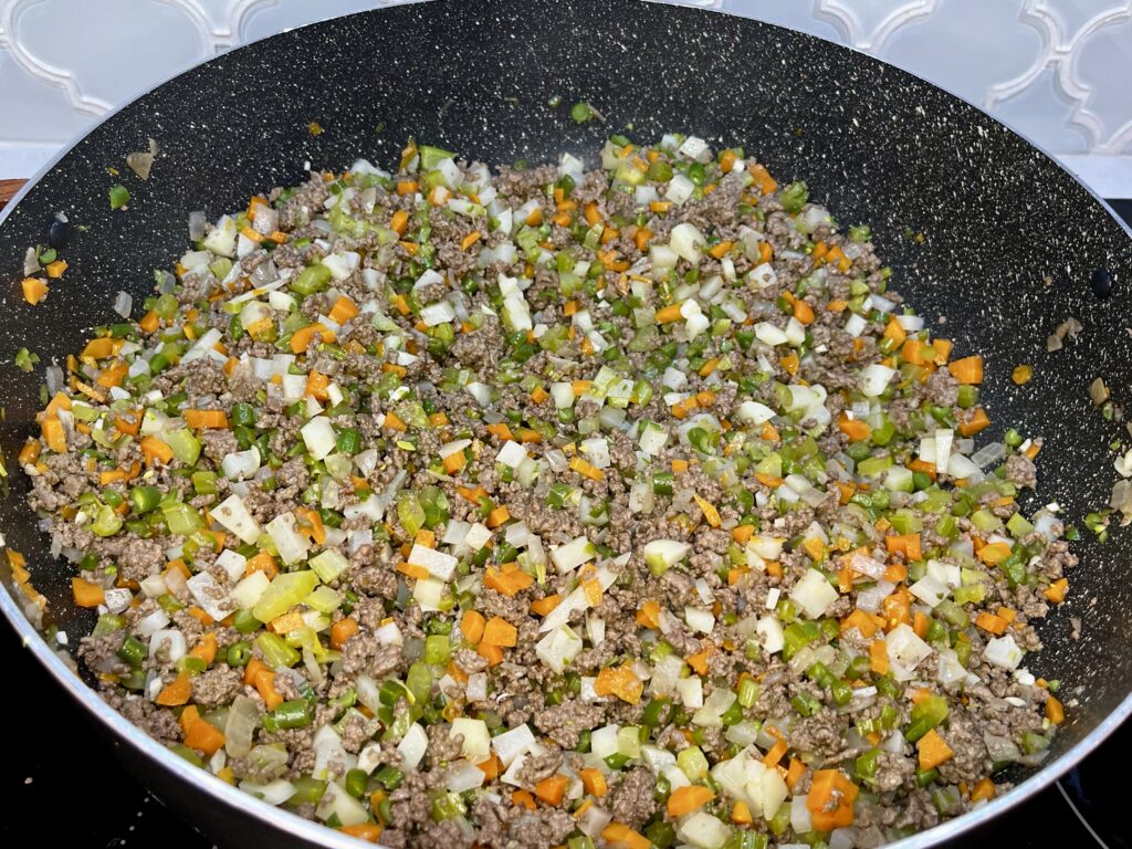 a pot of cooked beef and vegetable mixture