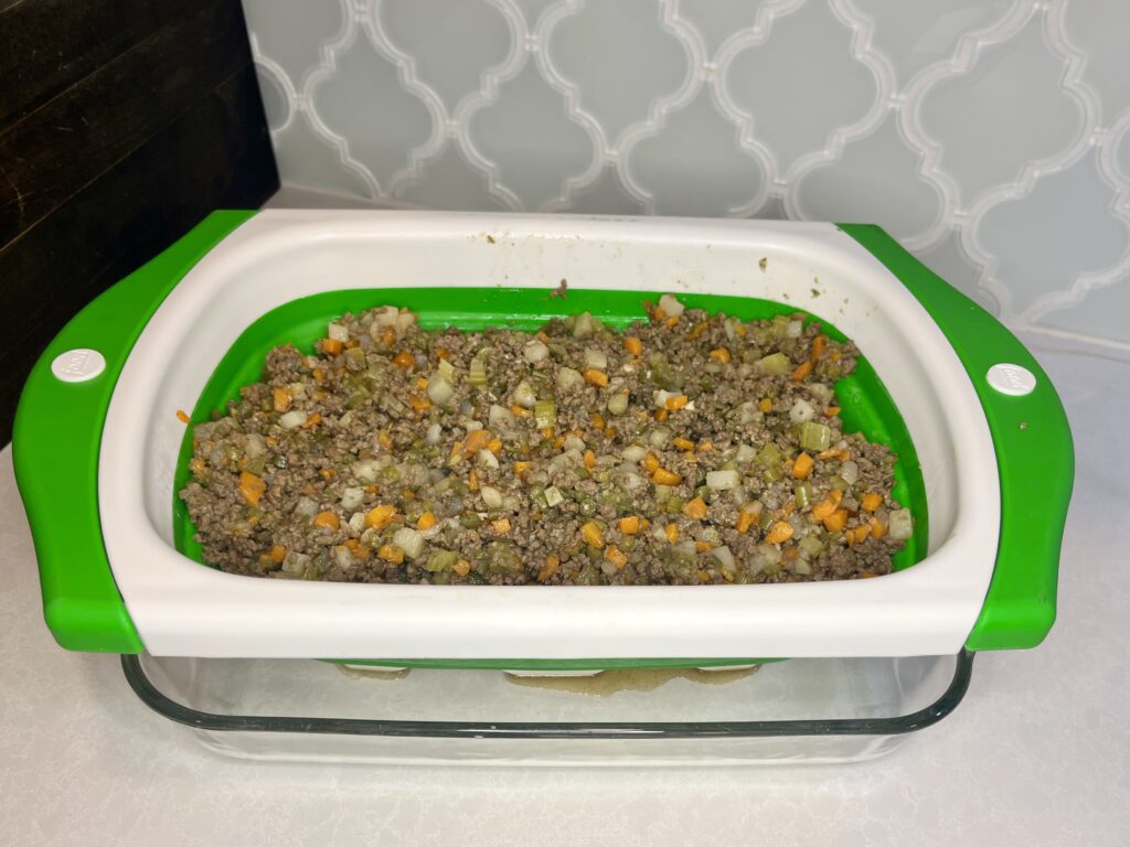 beef mixture in a colander on a counter 