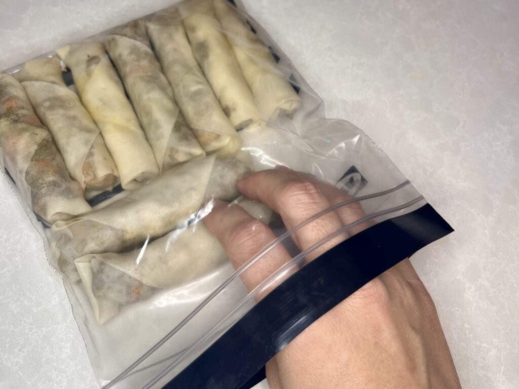 rolled lumpia in a freezer bag before frying
