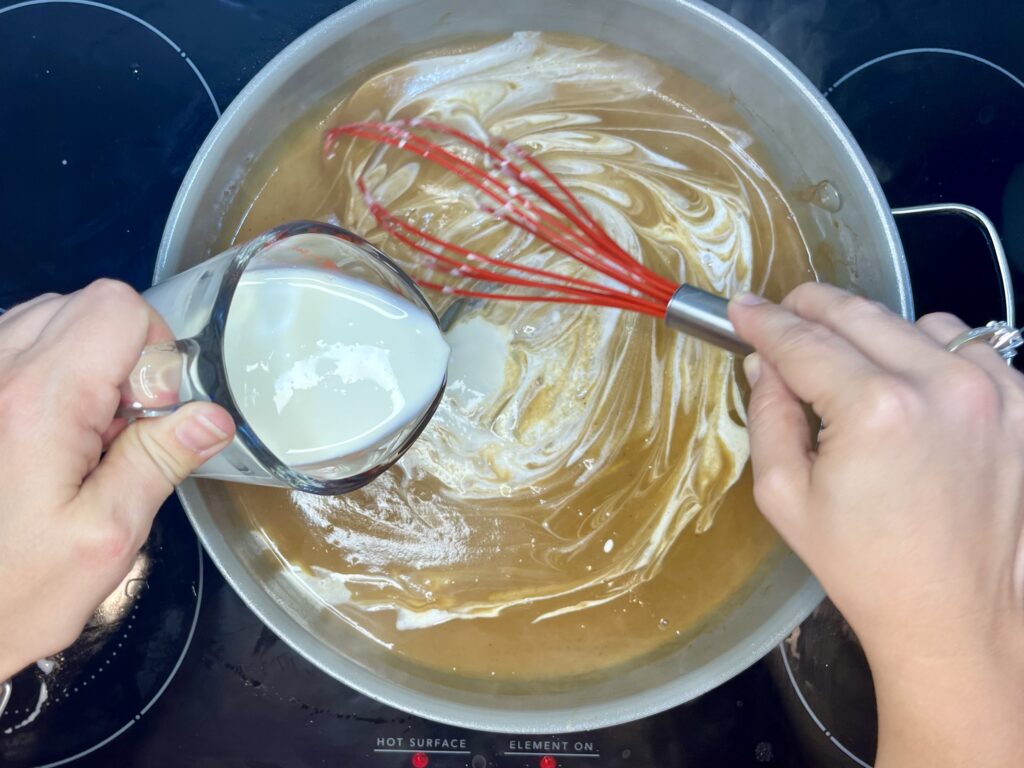 cream being added to the sauce