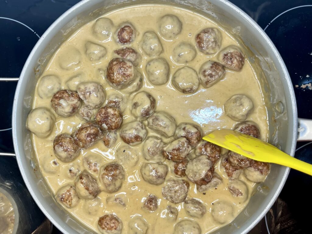 meatballs finishing cooking in sauce