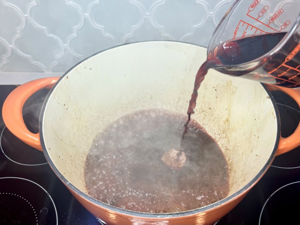 wine being poured into a pot