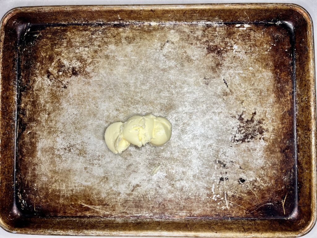 butter on a baking sheet 