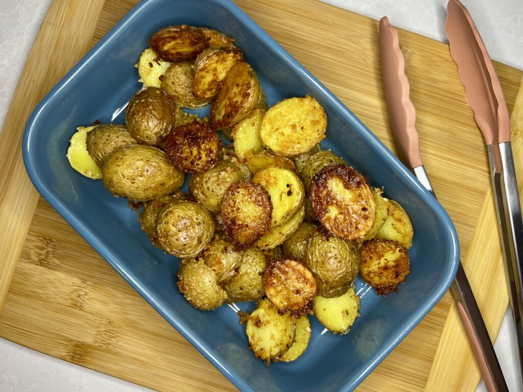 cooked parmesan potatoes in a dish