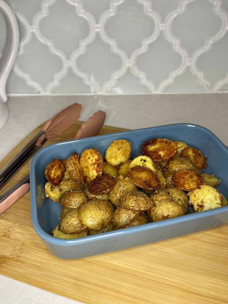 cooked parmesan potatoes in a dish