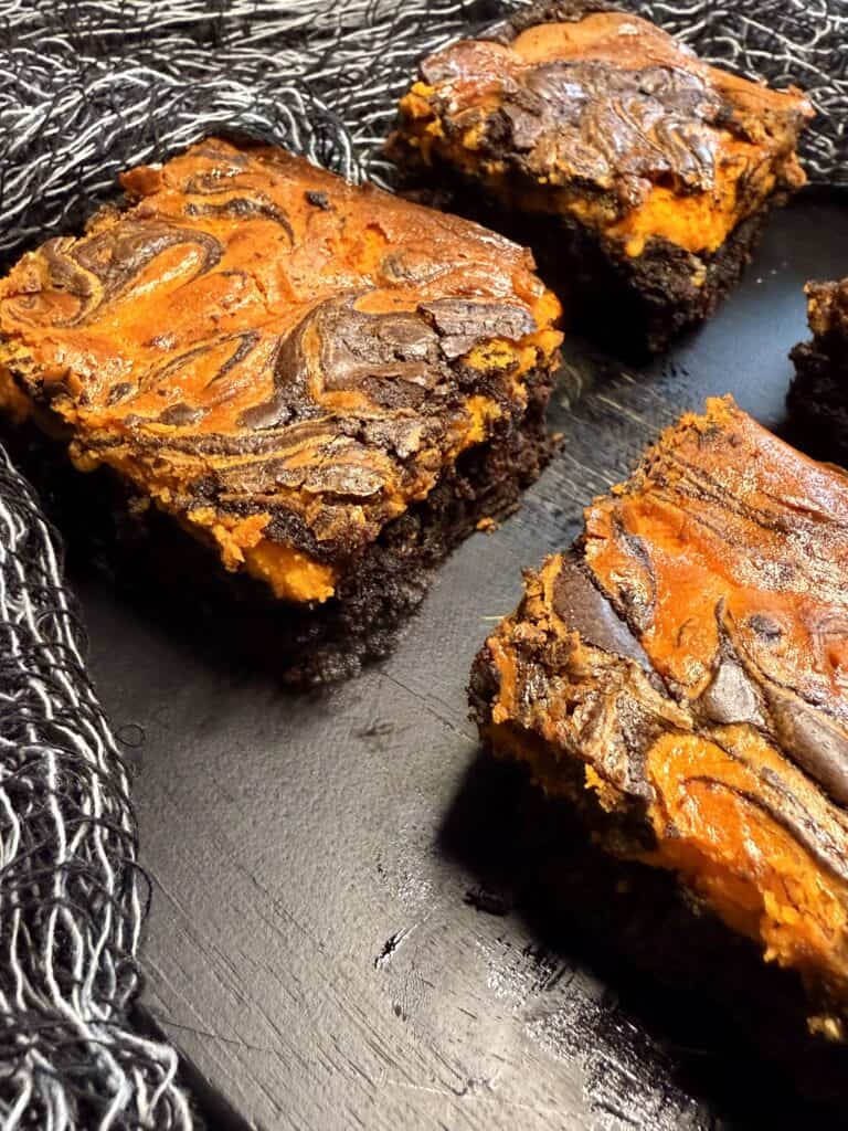 Gooey chocolate caramel brownies with a rich, fudgy texture and a gooey caramel swirl on top, perfect for dessert lovers seeking decadent homemade treats, homemade brownie recipes, sweet baked goods, and dessert ideas.