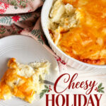 Cheesy holiday mashed potatoes in a white baking dish with a serving on a plate, topped with melted cheese, surrounded by festive holiday decor.