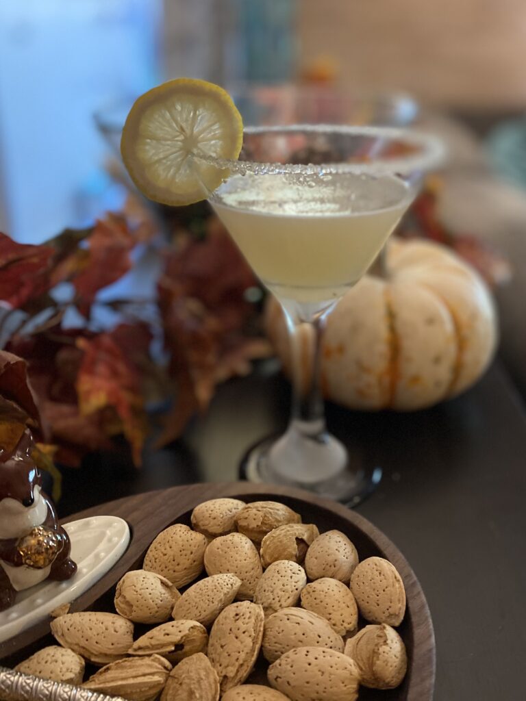 a martini on a table with fall decor